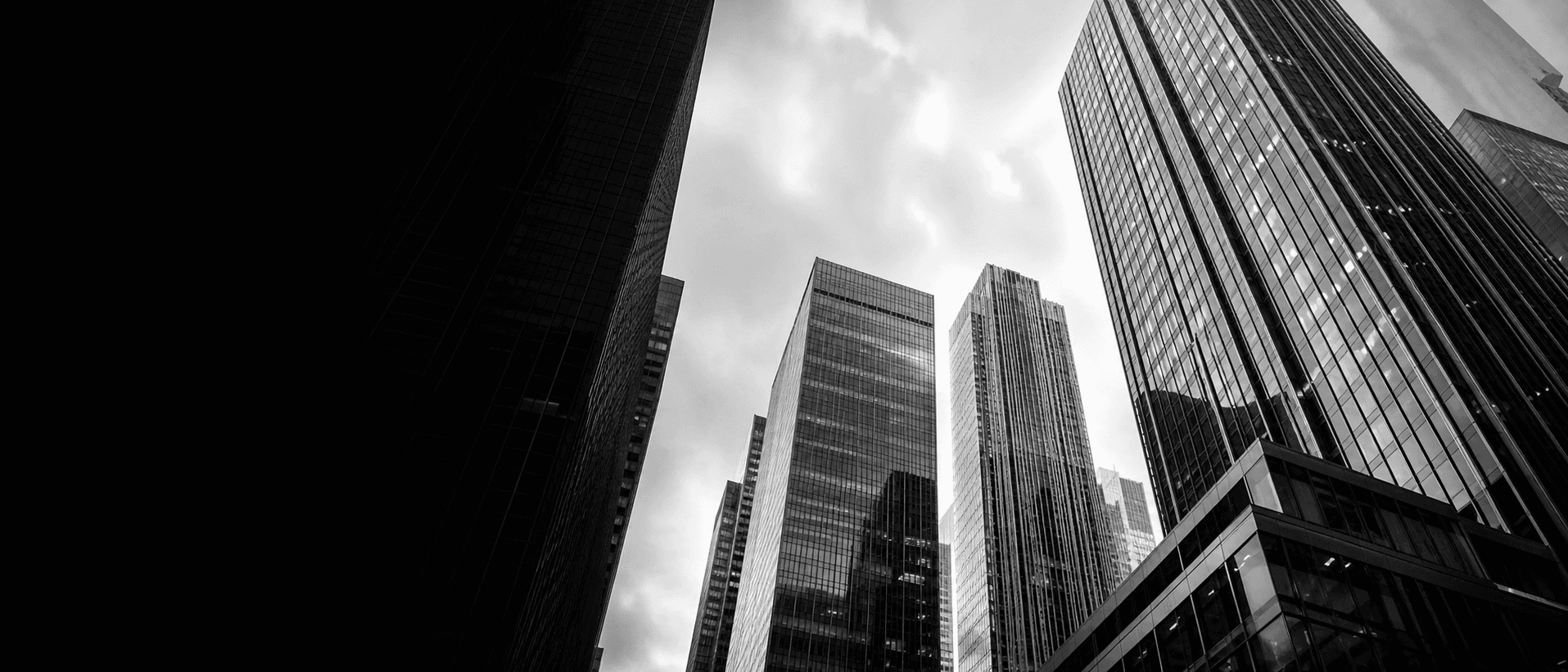 Modern glass office towers viewed from street level